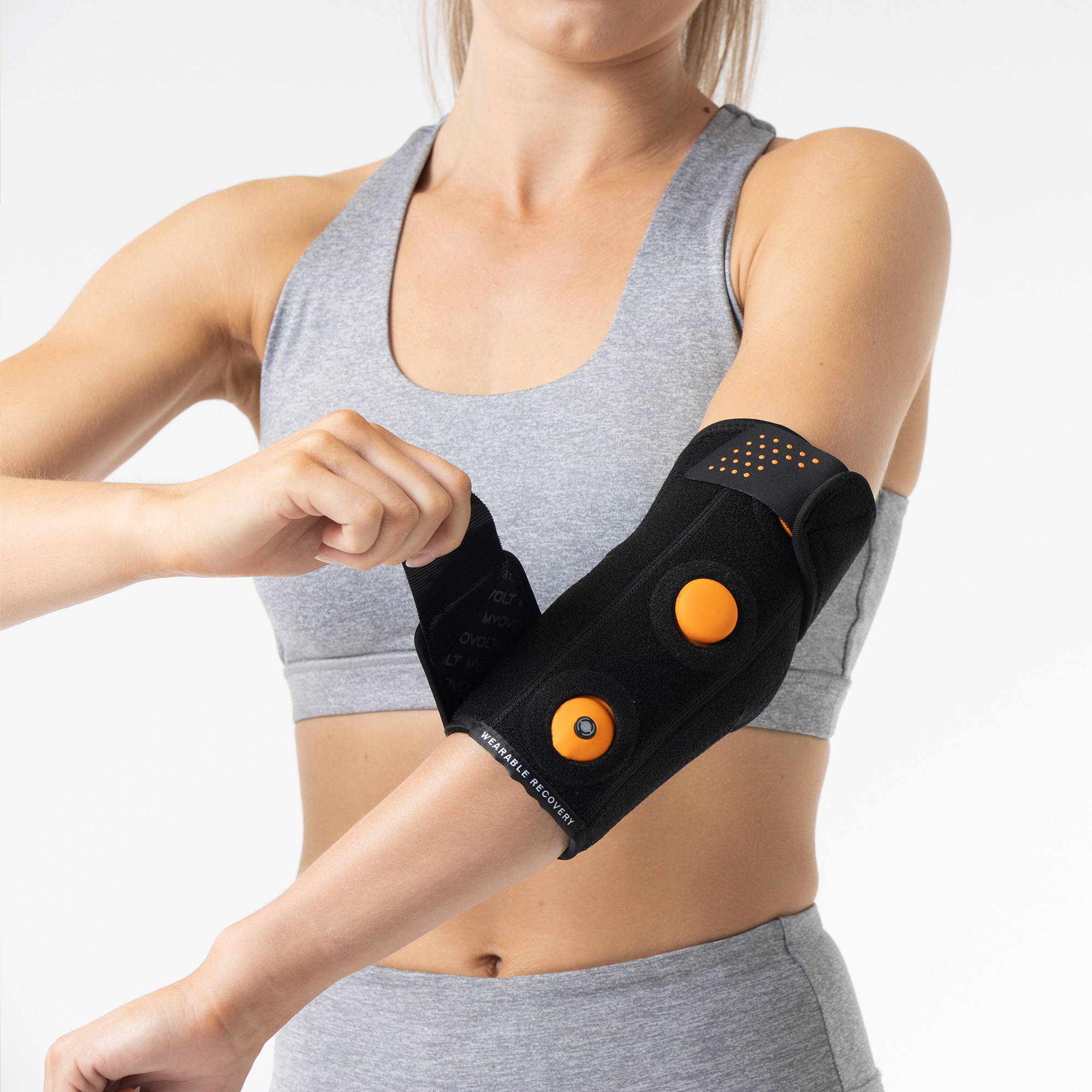 Myovolt vibration therapy arm brace for muscle pain relief, repetitive strain and tendinitis in elbows from sports and exercise.