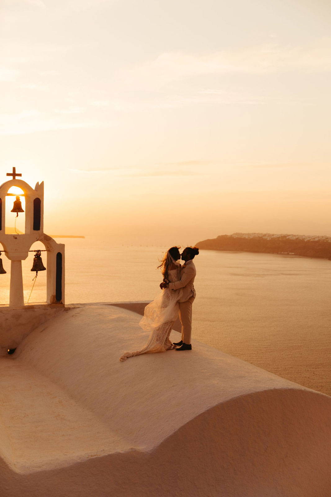 Bride and Groom sharing a kiss in Santorini
