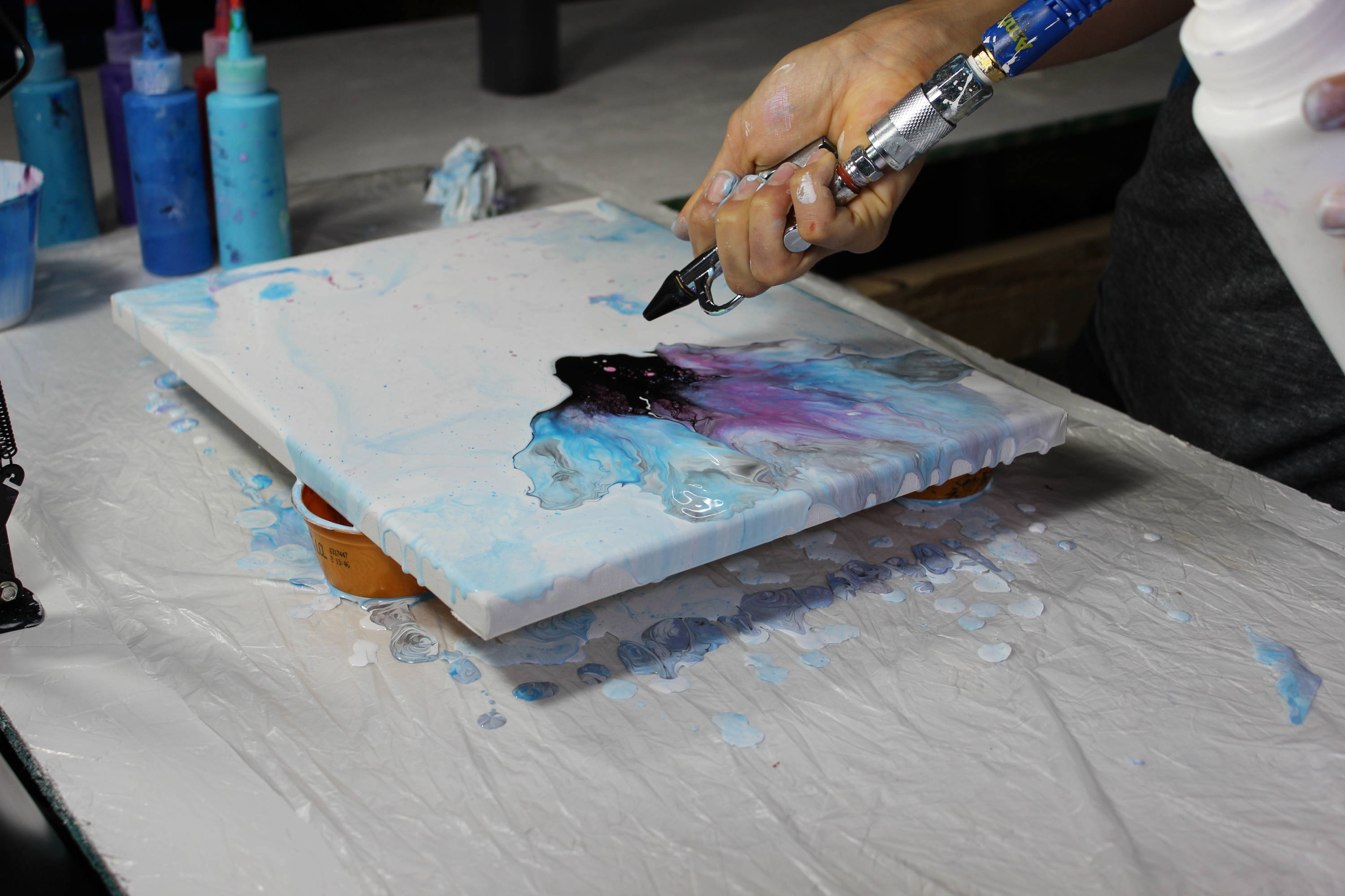 Creating Messy Ever After painting on a canvas