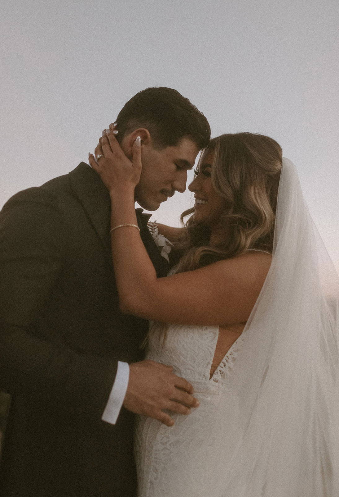 Bride and groom holding each other