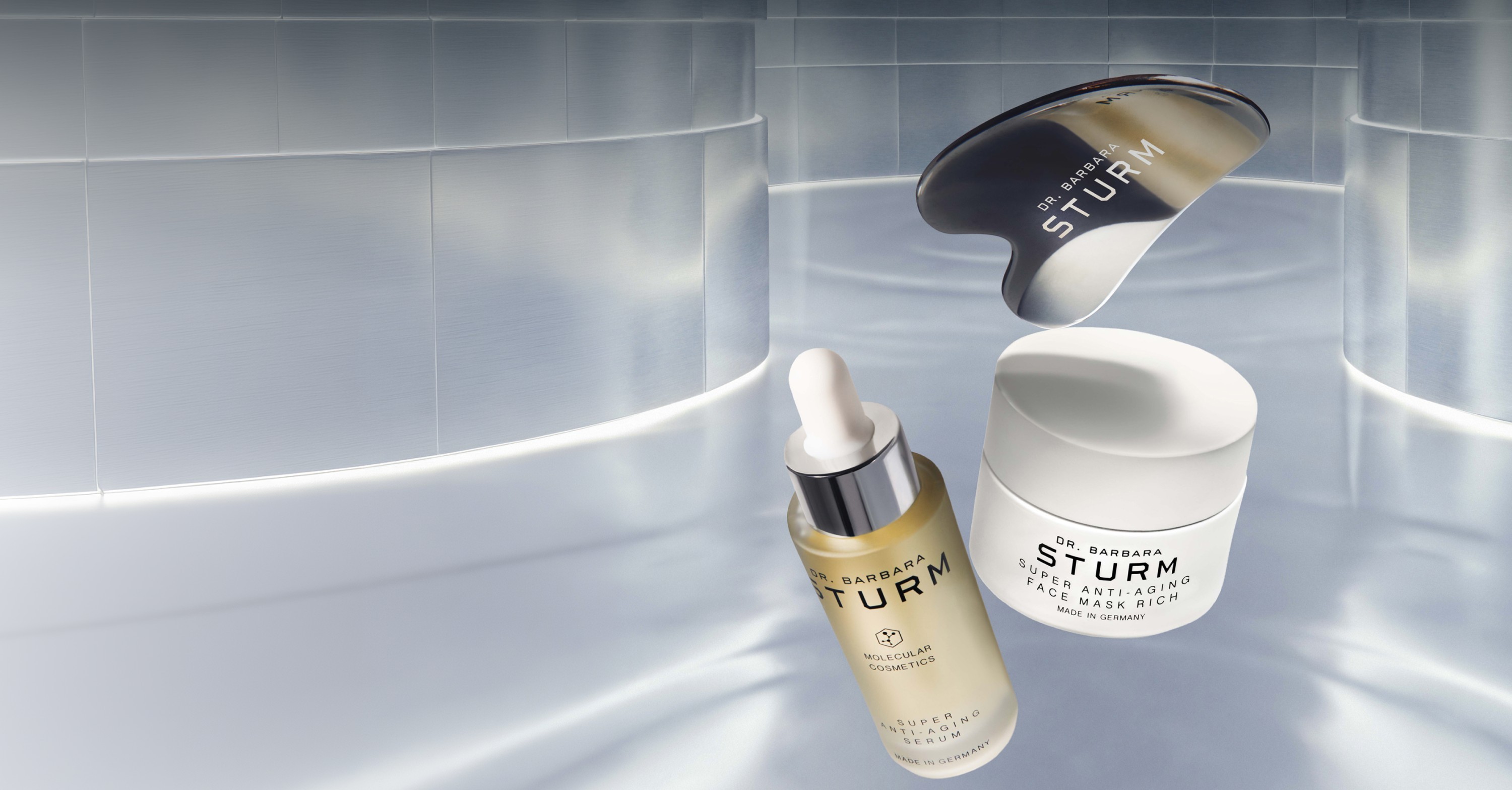 Skincare products including serum and cream against a light background.