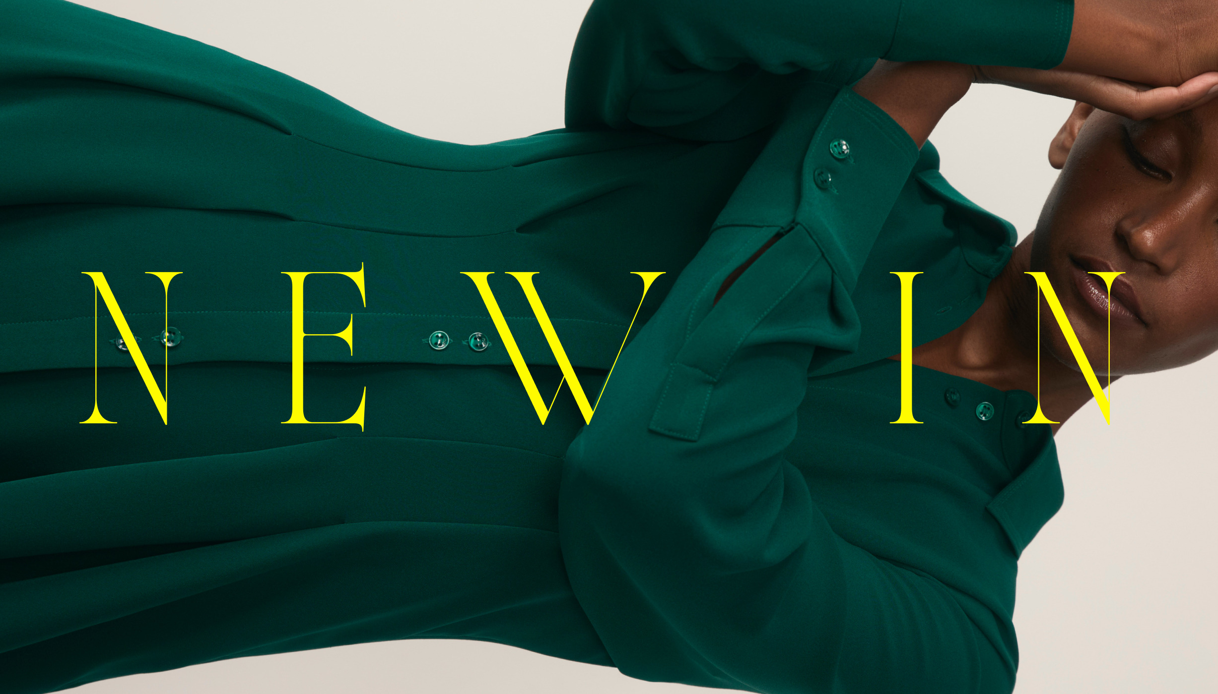 Shop new in - Model wearing green Amara crepe dress
