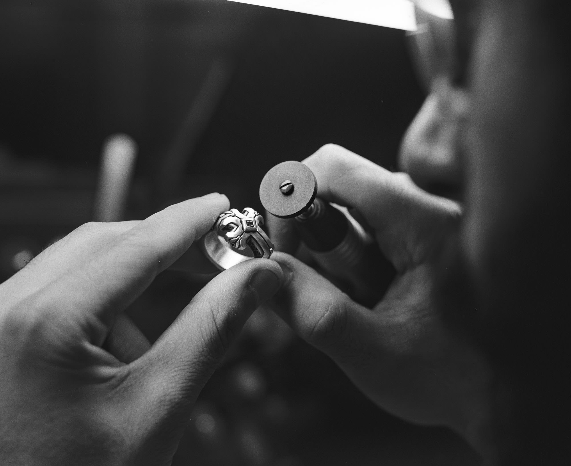 A NightRider jeweler handcrafting a Daily Disciple Ring.