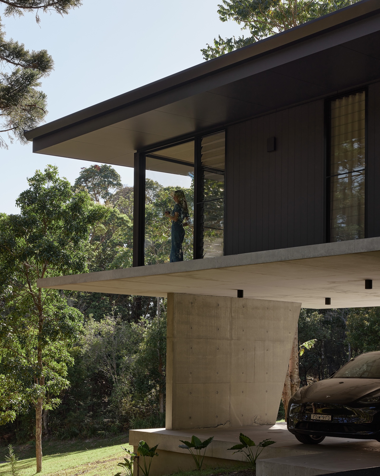 Minimalist house surrounded by trees