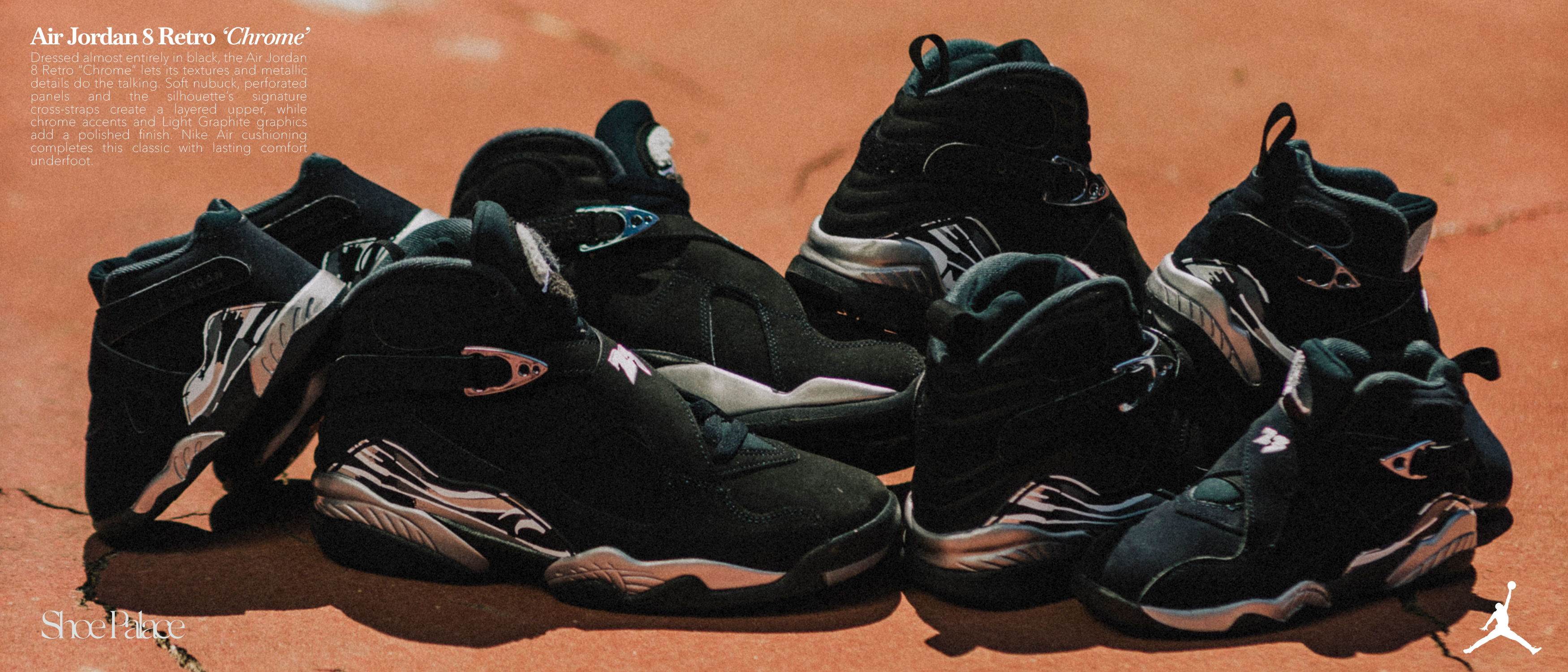 A collection of black athletic shoes arranged on a surface.