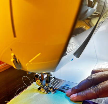 ¼-inch presser foot on fabric with straight seam