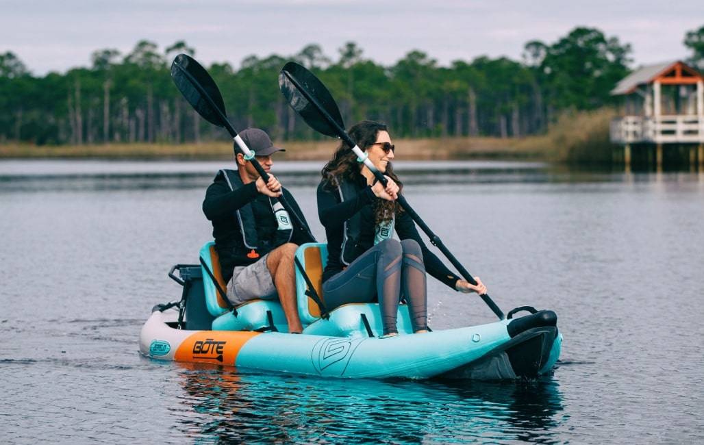 man and woman kayaking