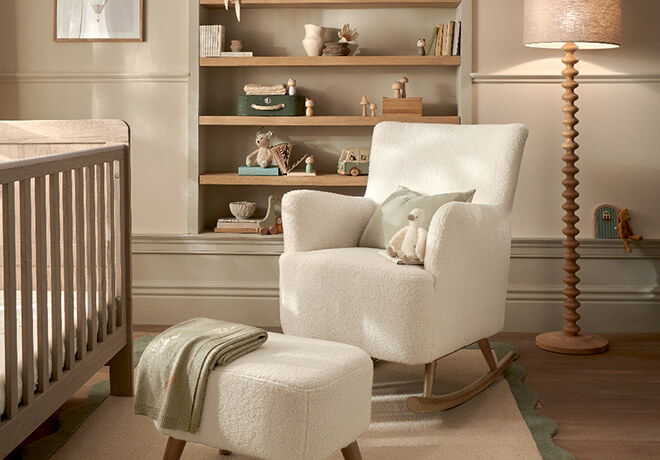 Cozy nursery with rocking chair, ottoman, bookshelf, and soft lighting.