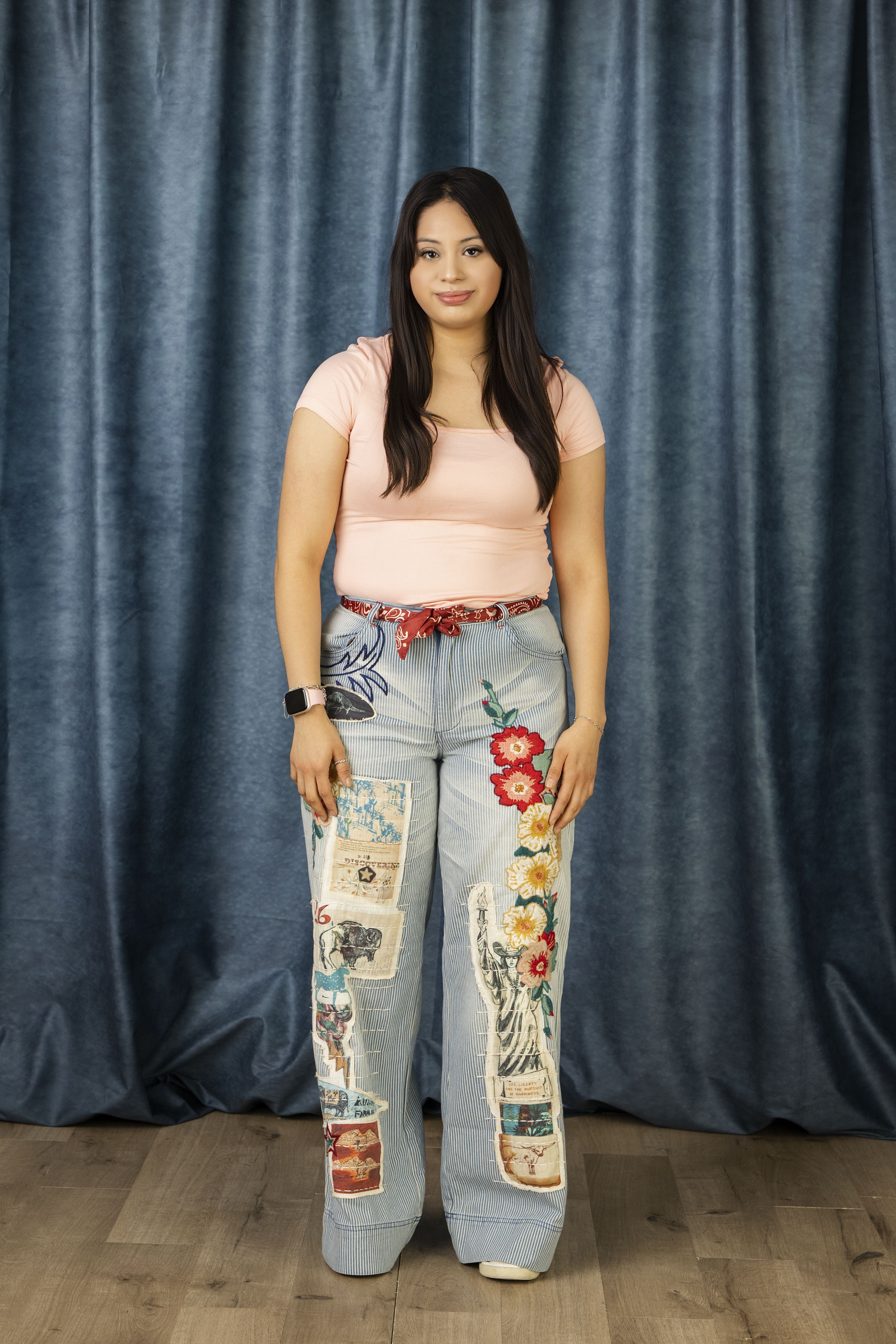 Nathaly wearing the We Salute Pants with a cute pink tee! 