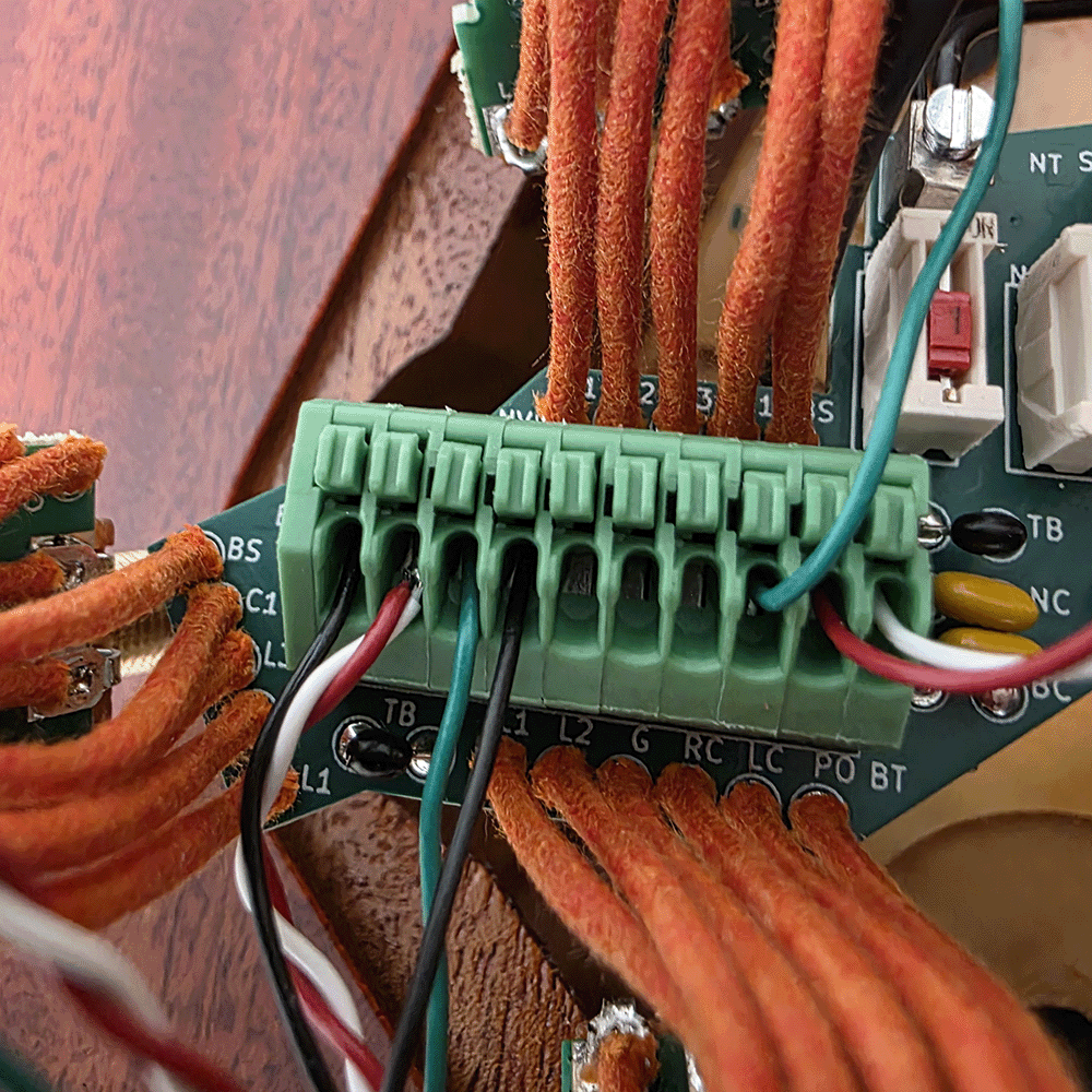 Close-up of a circuit board with connected wires and connectors.