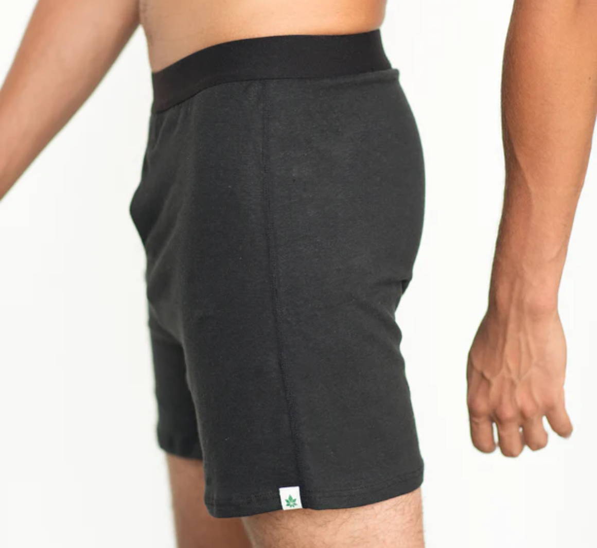 A man stands at a side angle in hemp boxers from WAMA