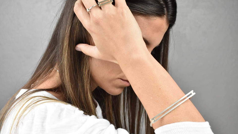 woman wearing flavia bennett bracelet and rings