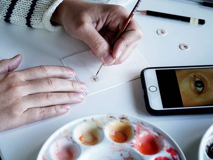 Sarah Miller painting a miniature eye portrait