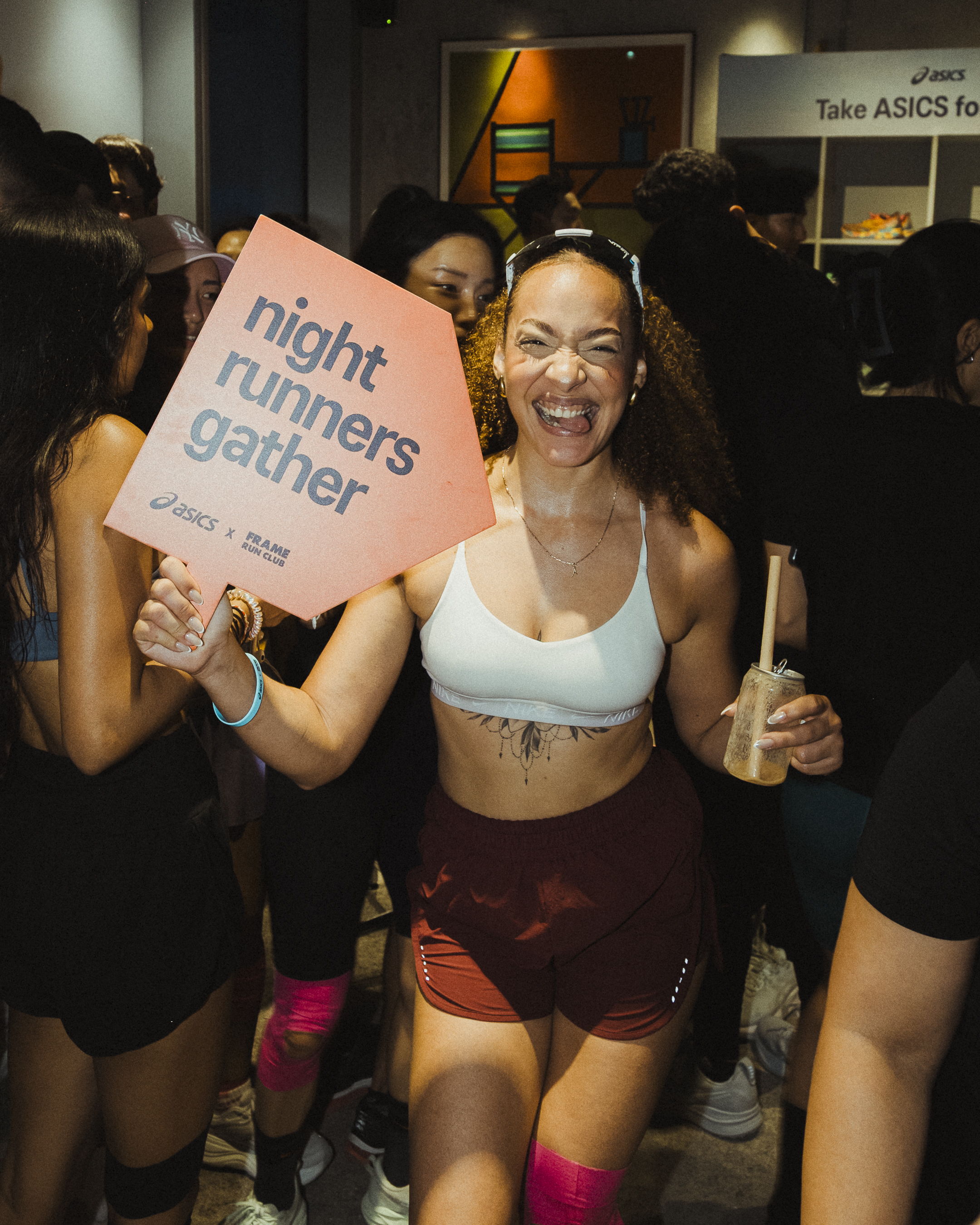 Happy runners celebrating Global Running Day with ASICS and FRAME RUN CLUB in Dubai Design District.
