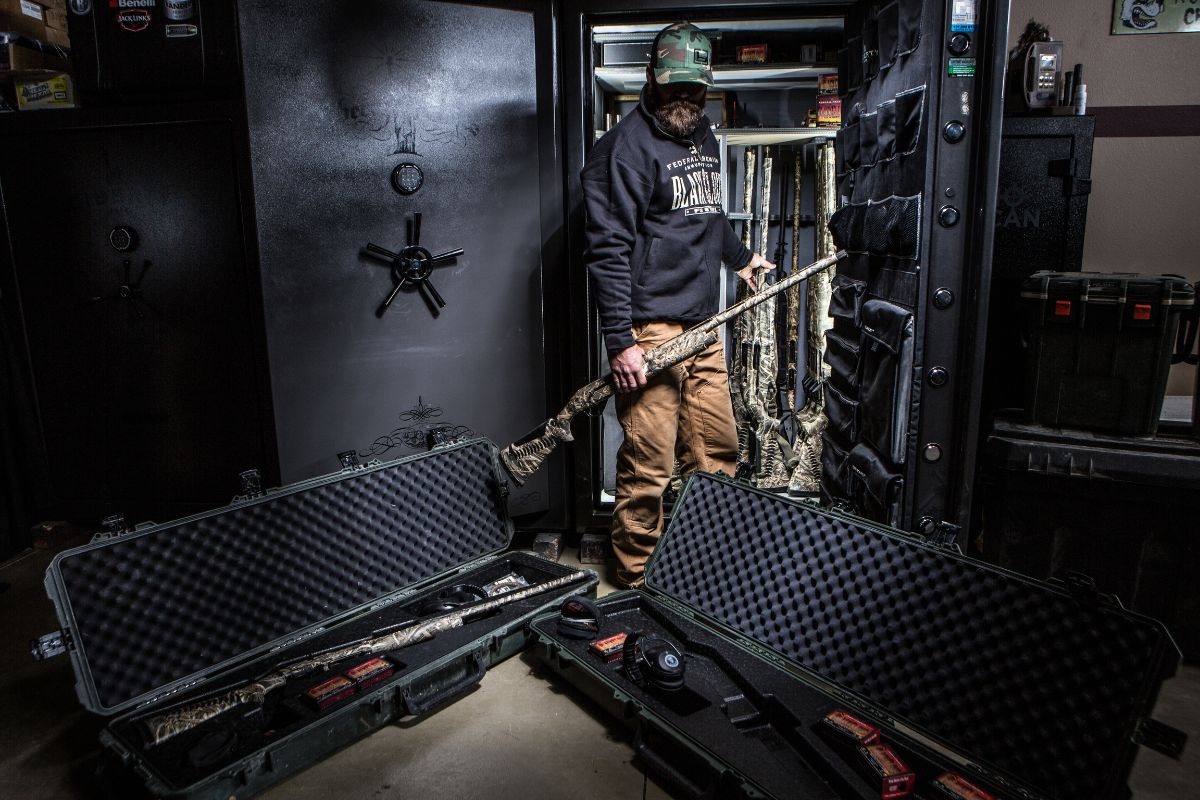 Person retrieving equipment from a secure storage unit.