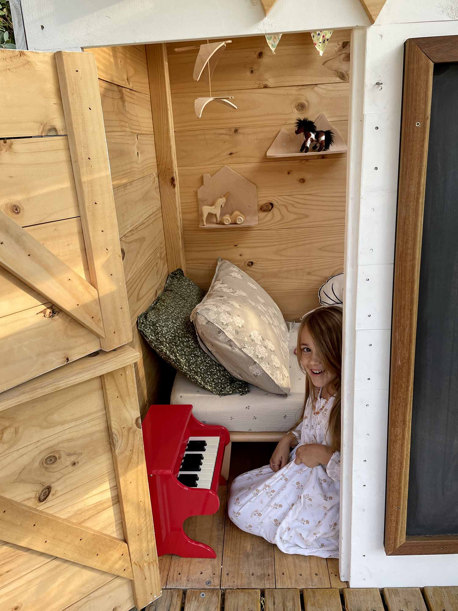 Kids hanging out in their cubby house