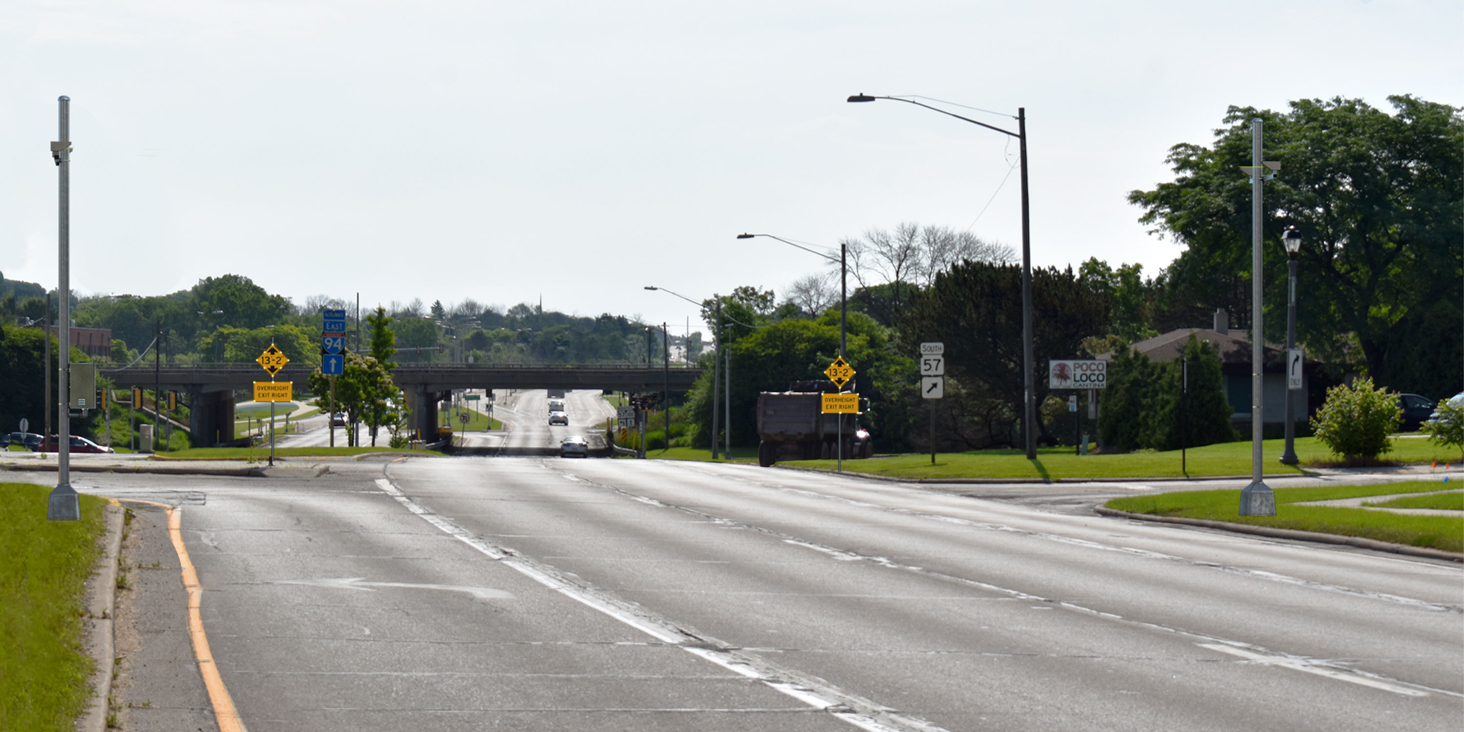 Overheight warning signs on the approach to a low bridge
