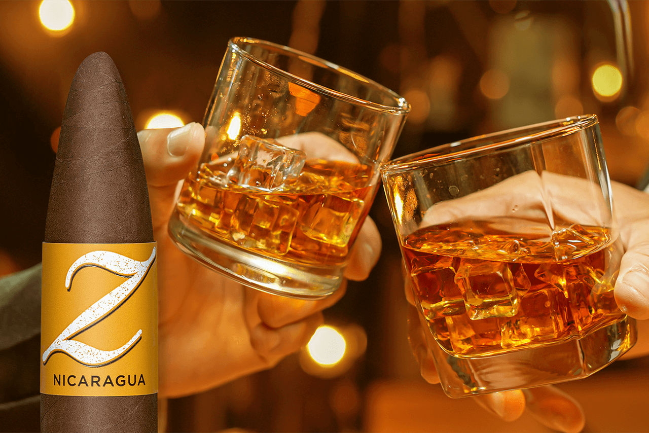 A Zino Nicaragua cigar in front of a background of two hands clinking glasses of rum.