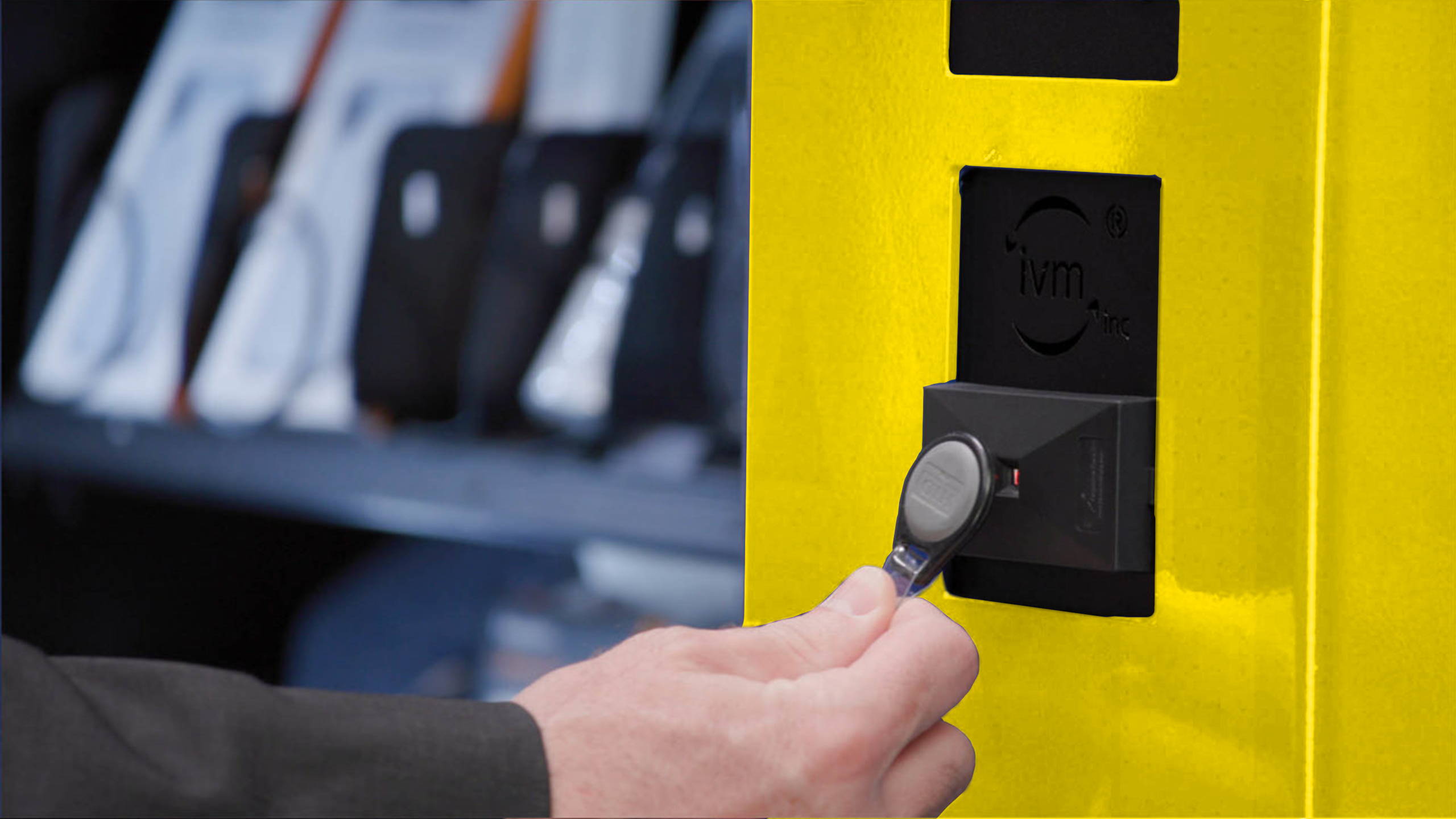 Man using RFID badge with PPE vending machine.