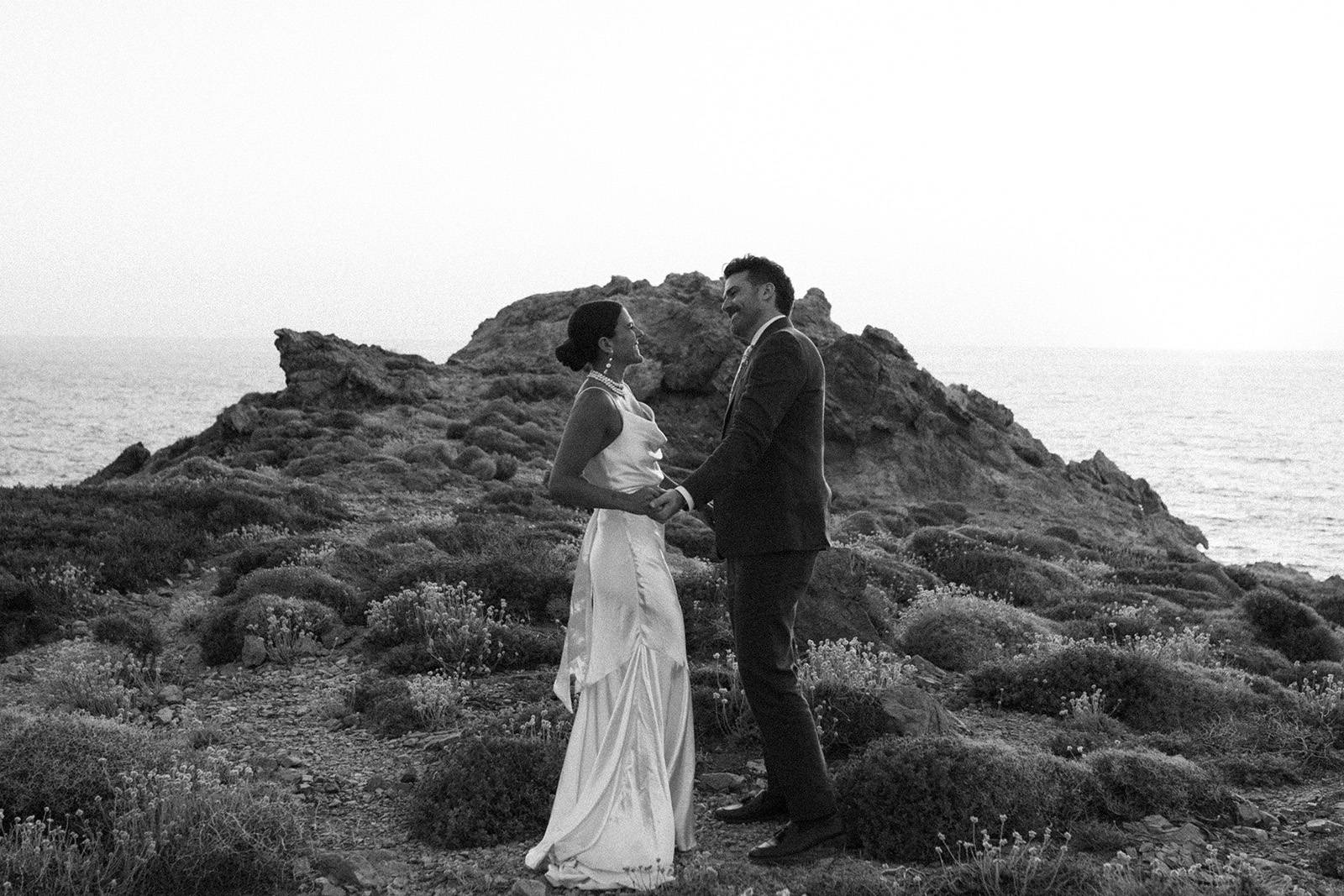 Bride and groom, admiring the sea