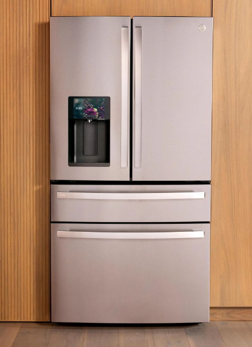 A modern stainless steel refrigerator with a water dispenser and multiple compartments.