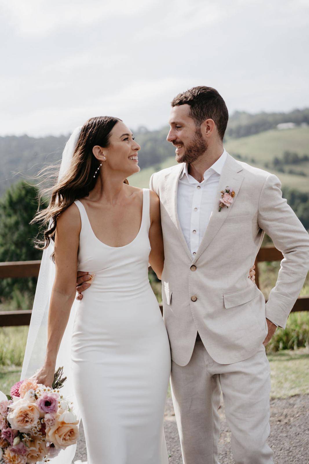 Bride and groom holding each other