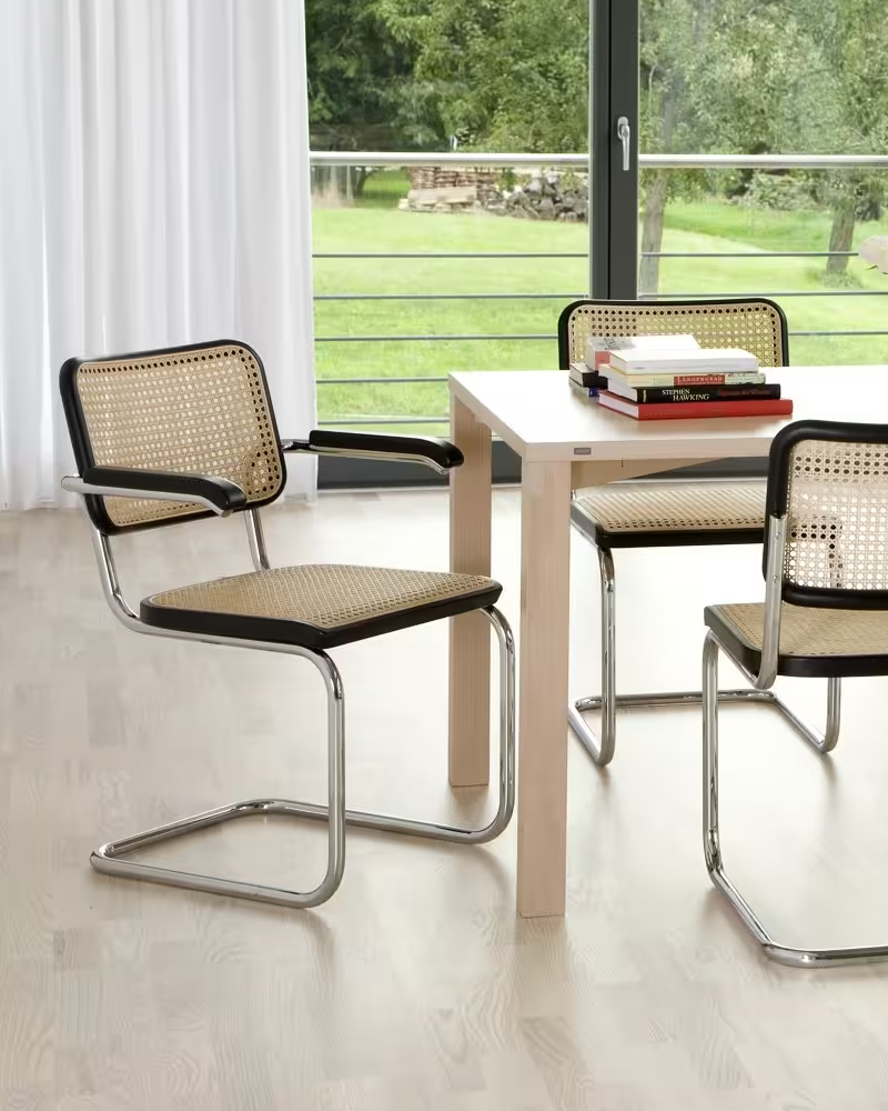 Modern S 32 V Dining chair with a wooden frame and mesh seat and backrest.