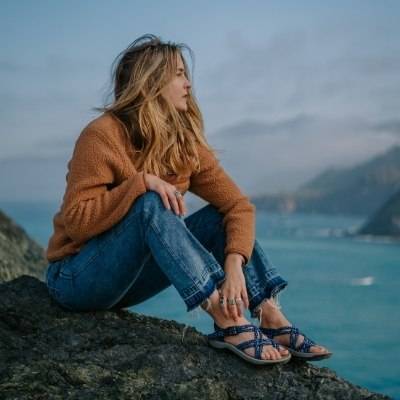 Woman on rocks wearing Siena Sport Sandals by Viakix 