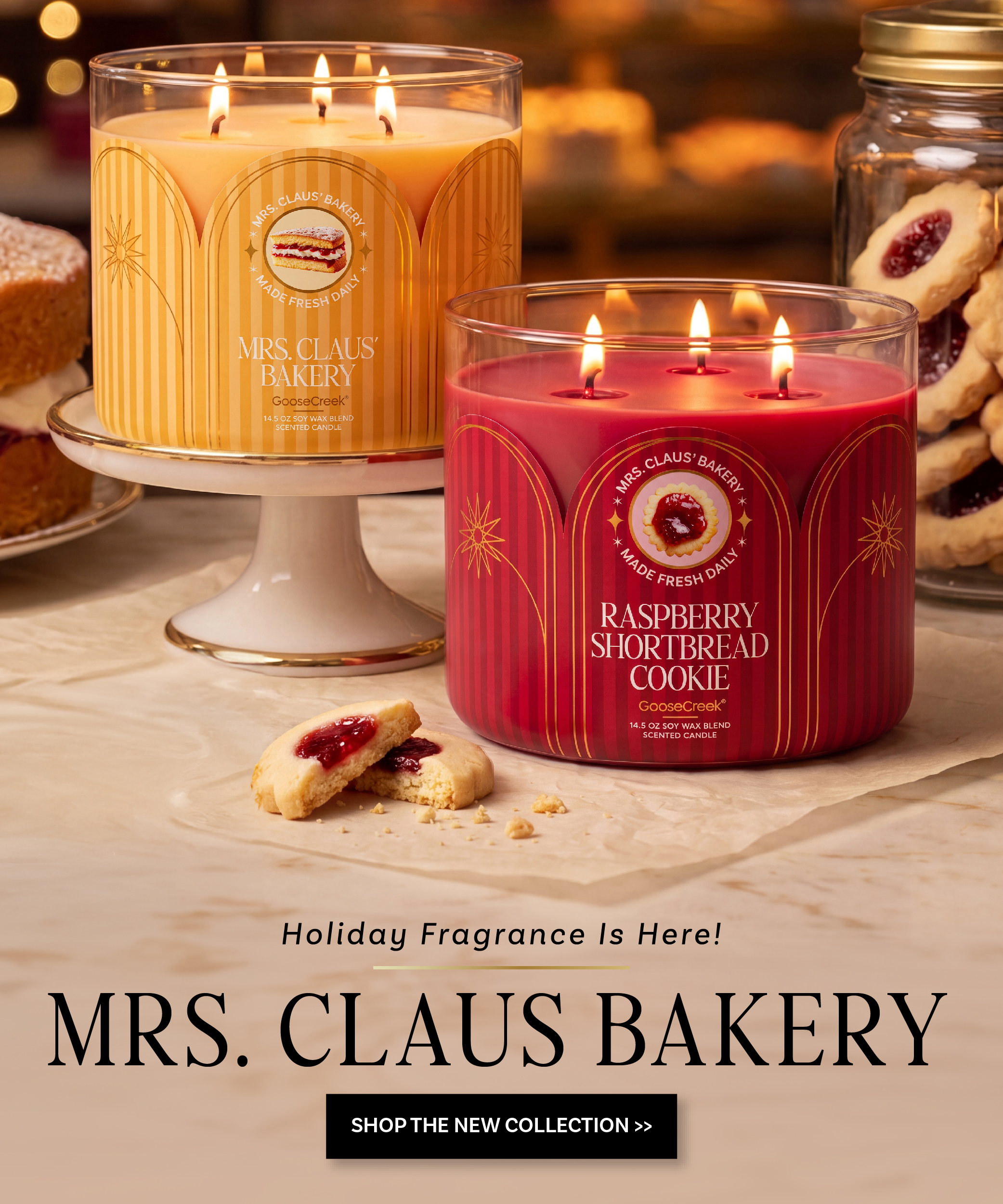 Candles with holiday scents, cookies, and promotional text for Mrs. Claus Bakery.
