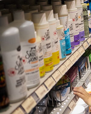 Bottles of various hair products on a store shelf.