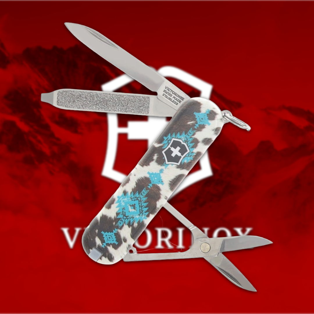 Victorinox multi-tool with floral design on a red background.