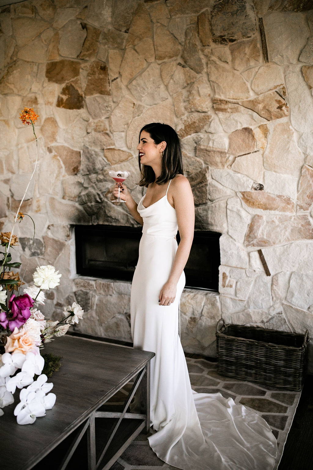 Bride wearing the Grace Loves Lace Honey wedding dress toasting at her wedding