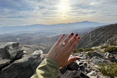 engagement ring with mountains in background joshua tree 