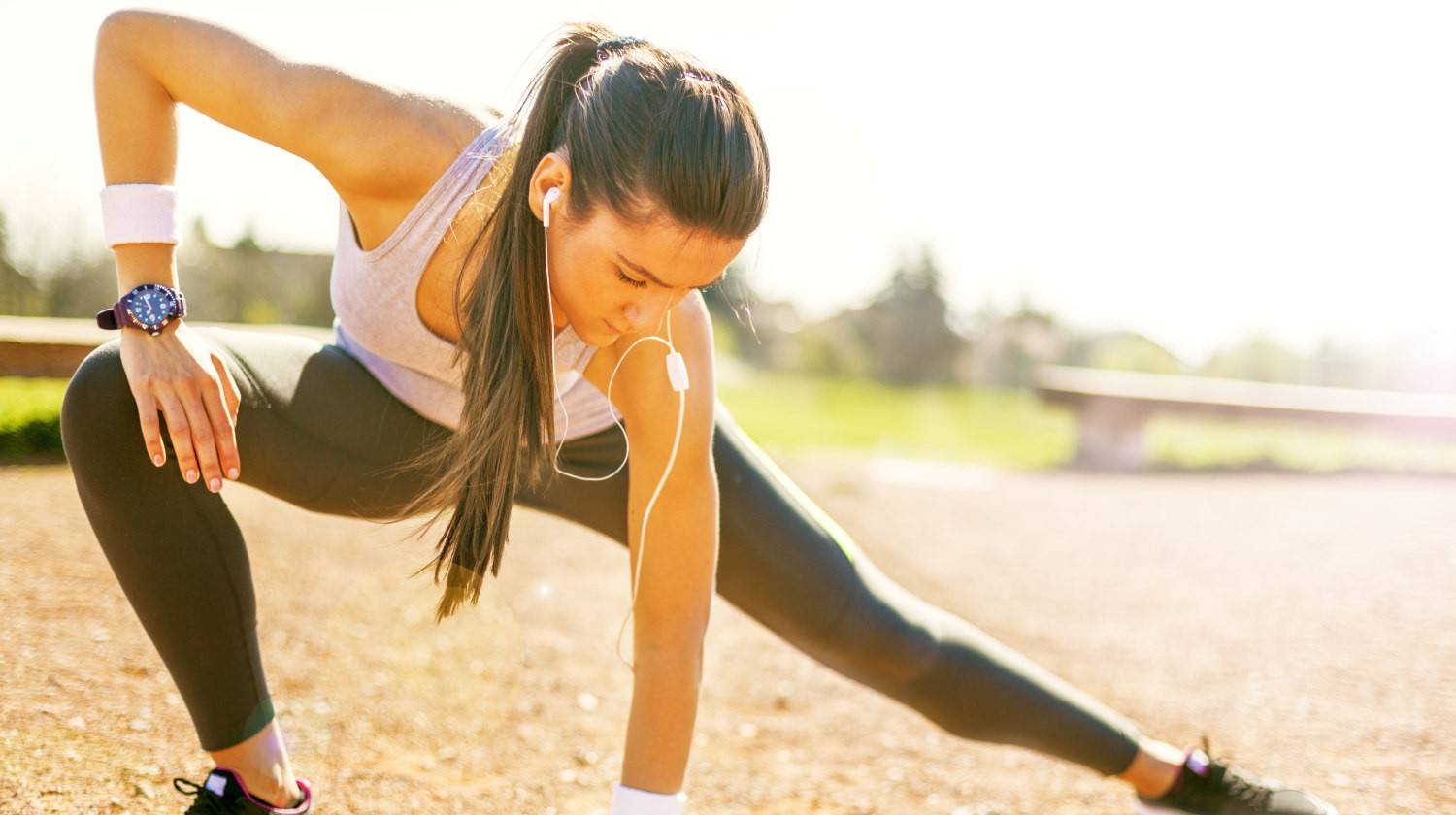 Young sportswoman stretching and preparing to run | The Benefits Of Rice Protein Powder | does rice have protein | Featured