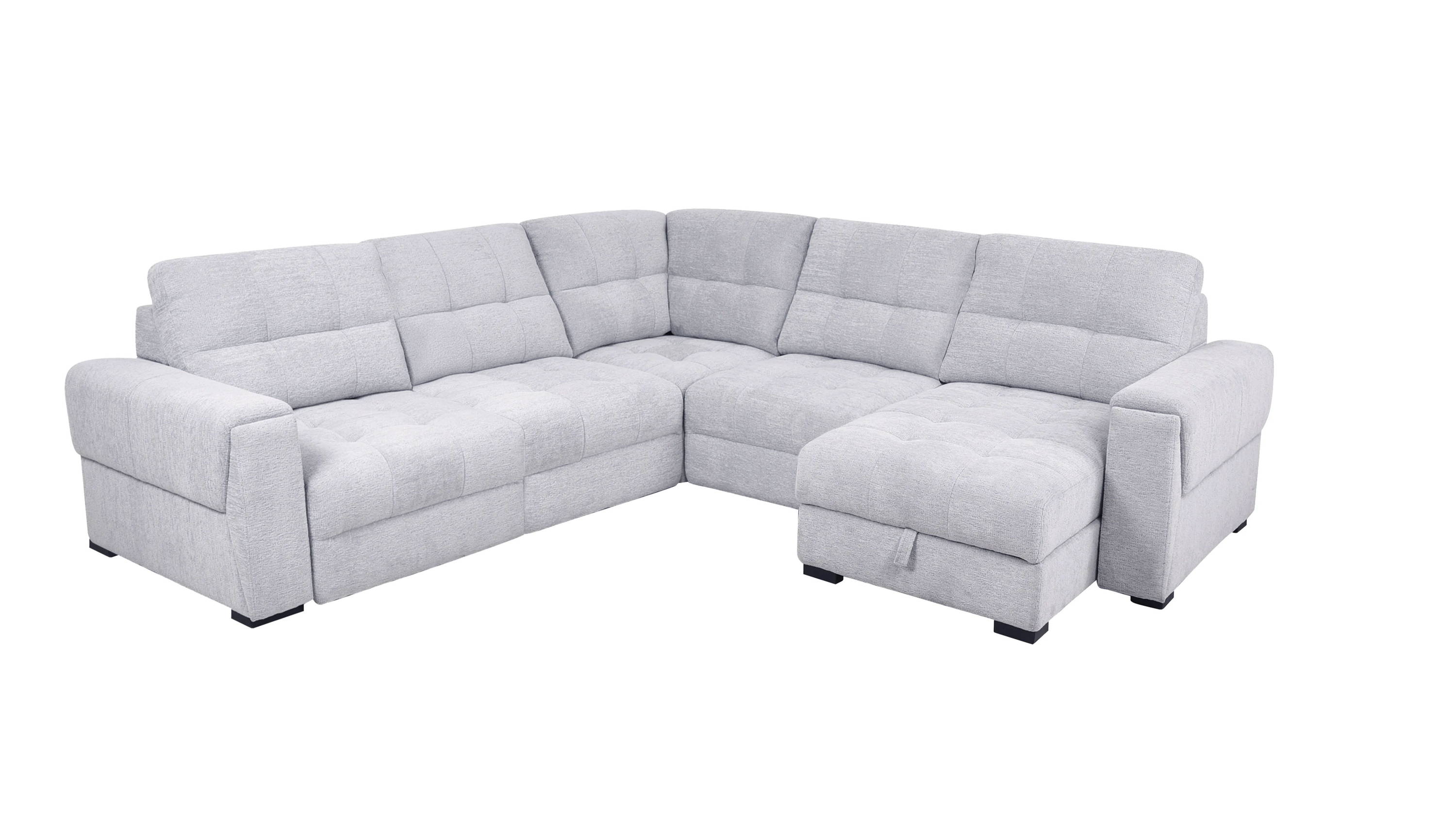 A modern, light gray sectional sofa with plush cushions.