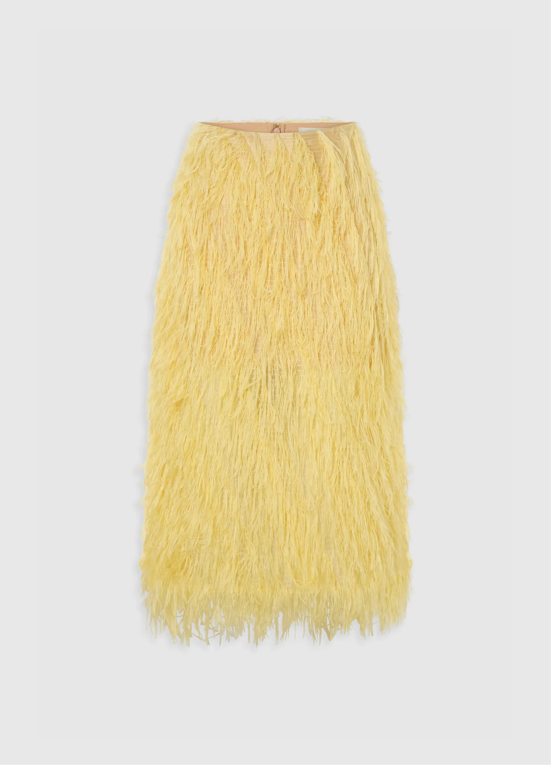 Yellow fringed skirt on a light background.