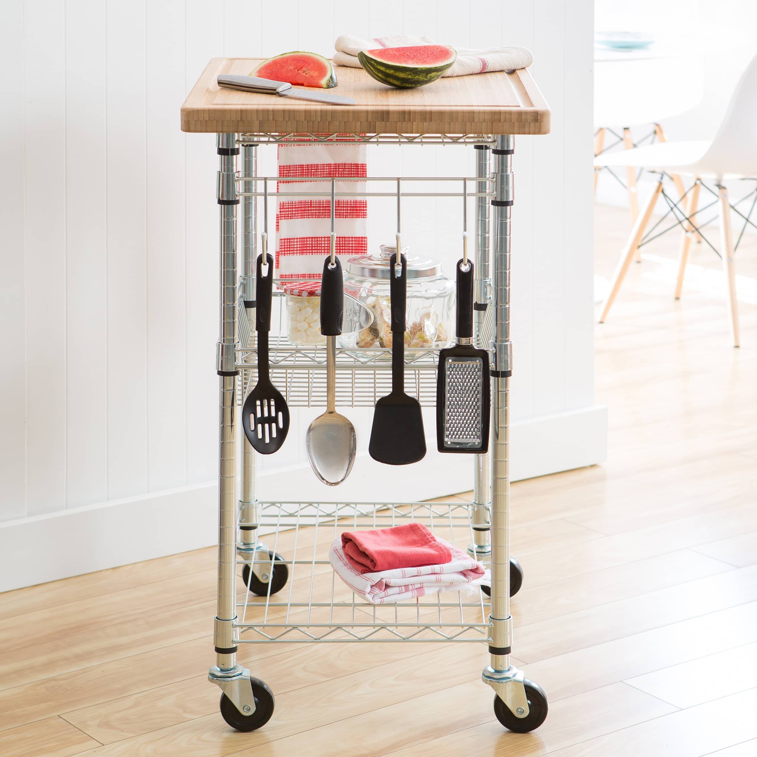 kitchen cart with hanging bar filled with cooking utensils