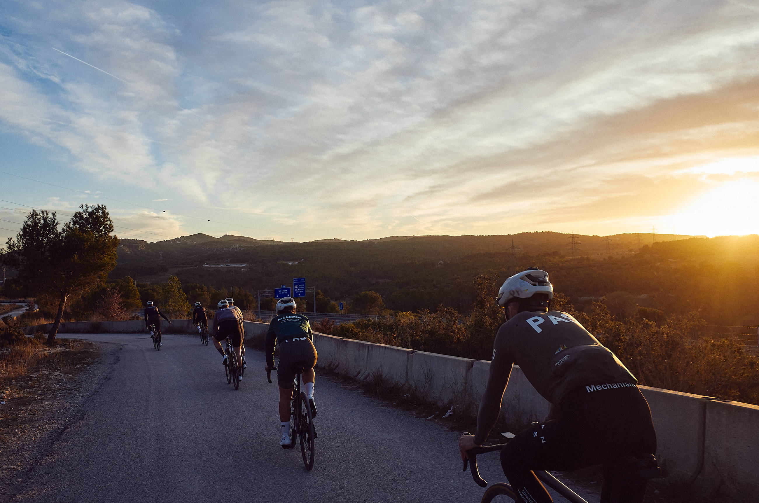 Cyclists riding in the sunset