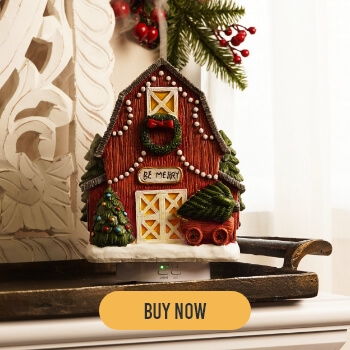 Christmas-themed barn decoration with greenery and a 