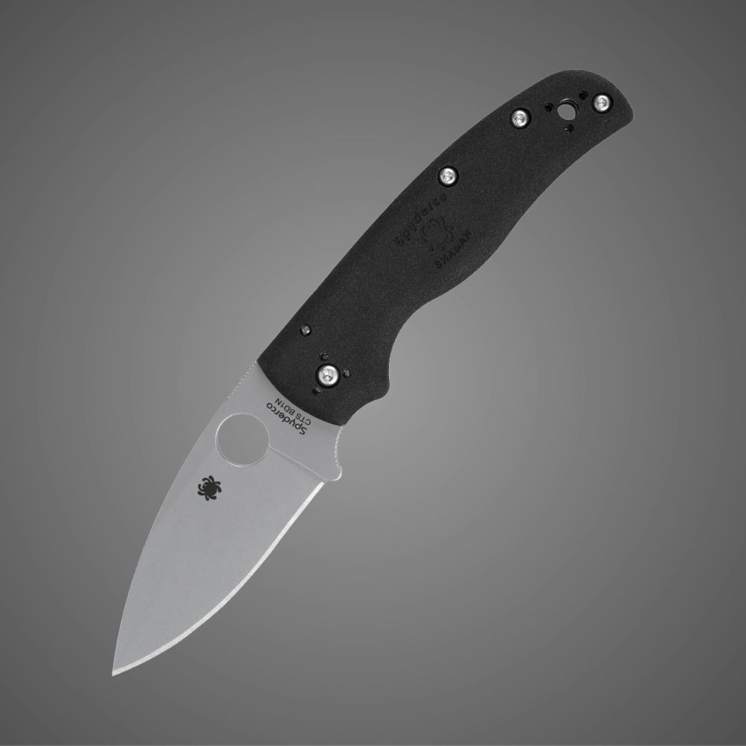 A silver folding knife with a black handle.