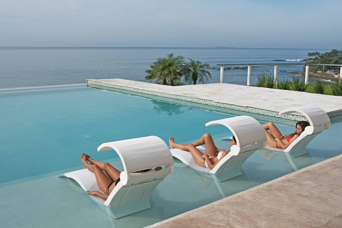 An in-pool chaise lounge that is designed with water depths of 10-15 inches.