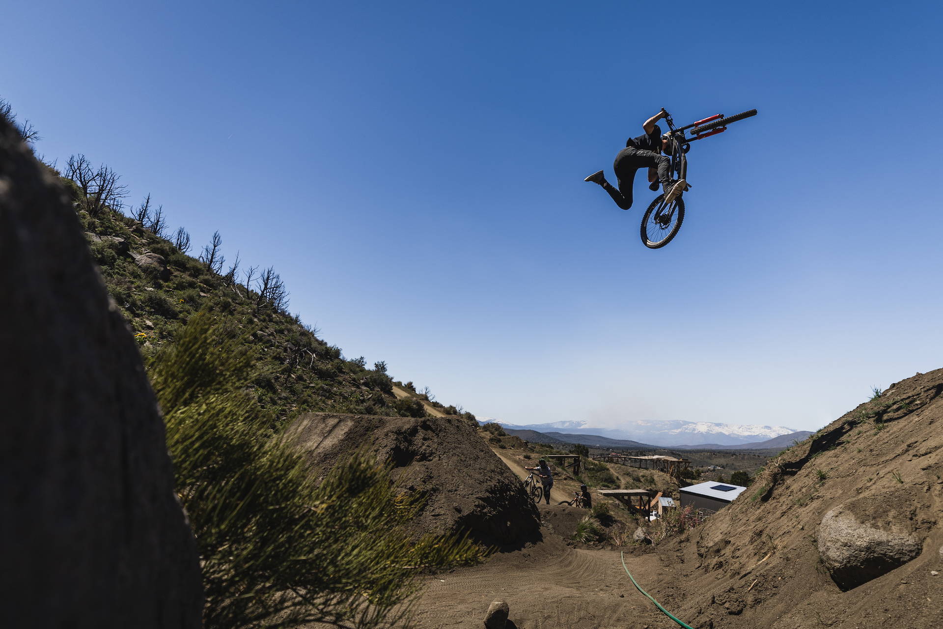 DJ Brandt hitting big features on his Nukeproof Dissent downhill bike