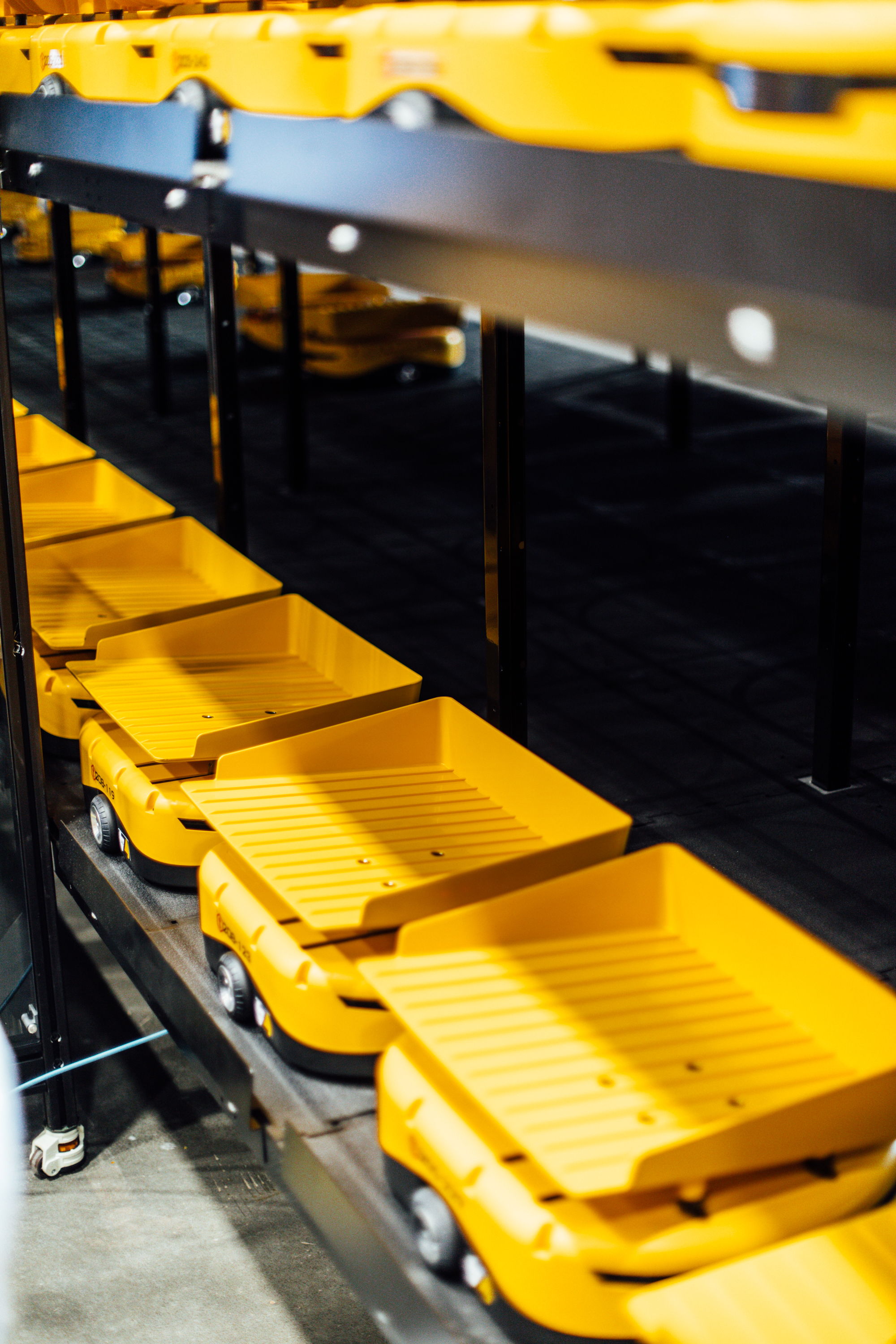 fleet of tompkins robots waiting for packages to sort. 