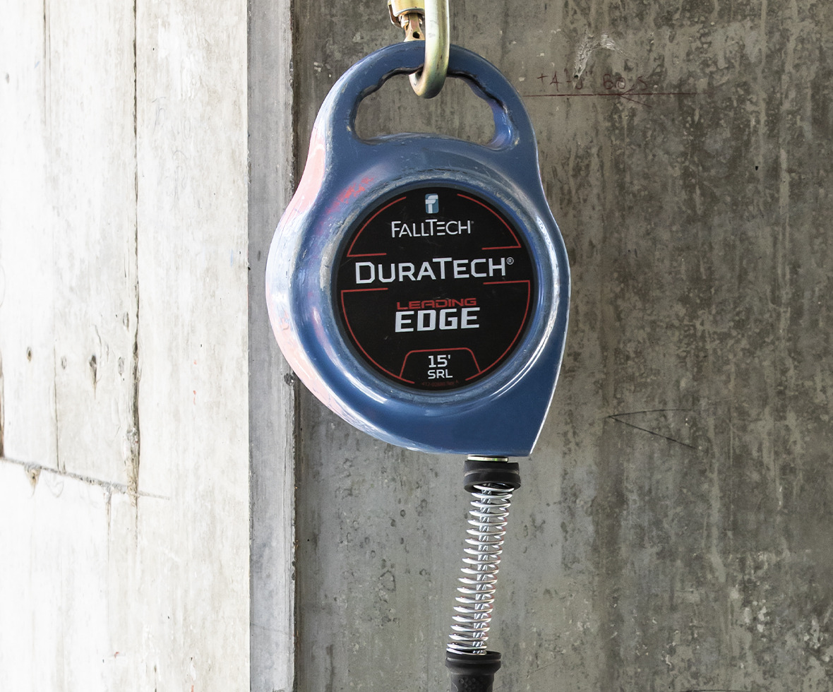 DuraTech Leading Edge self-retracting lifeline block hanging against concrete structure