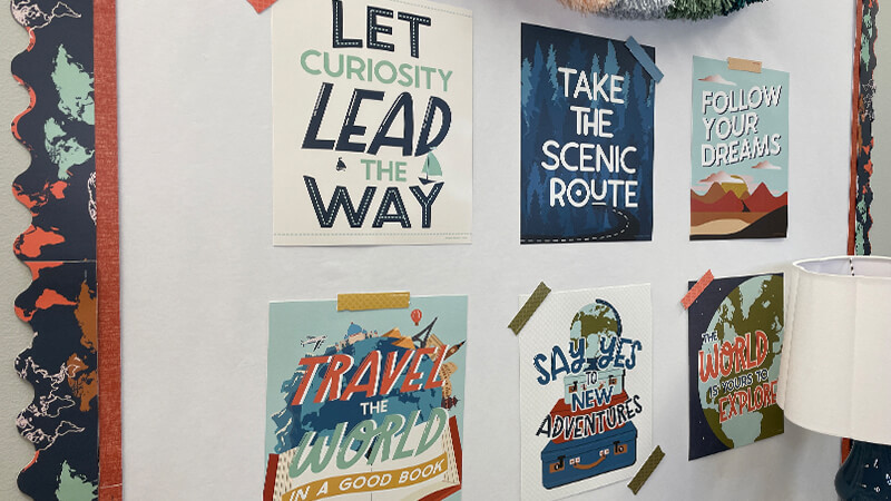 Motivational posters featuring Take the Scenic Route and Follow Your Dreams.