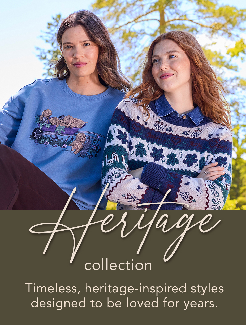 Two women model sweaters from the Heritage collection outdoors.