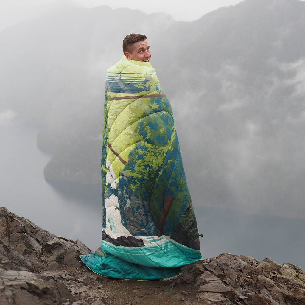 Mikah Meyer in Rumpl Olympic National Park Blanket