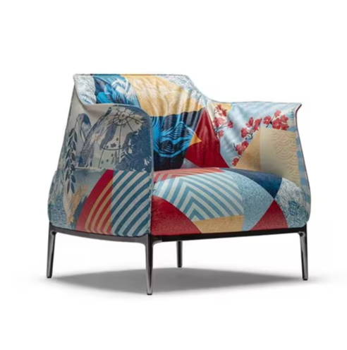 Colorful patterned armchair with a modern design and metal legs.