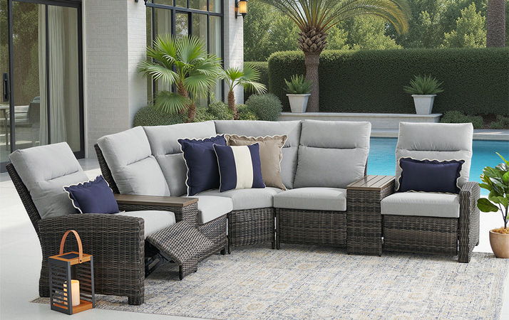 Outdoor sectional sofa with cushions by a poolside.