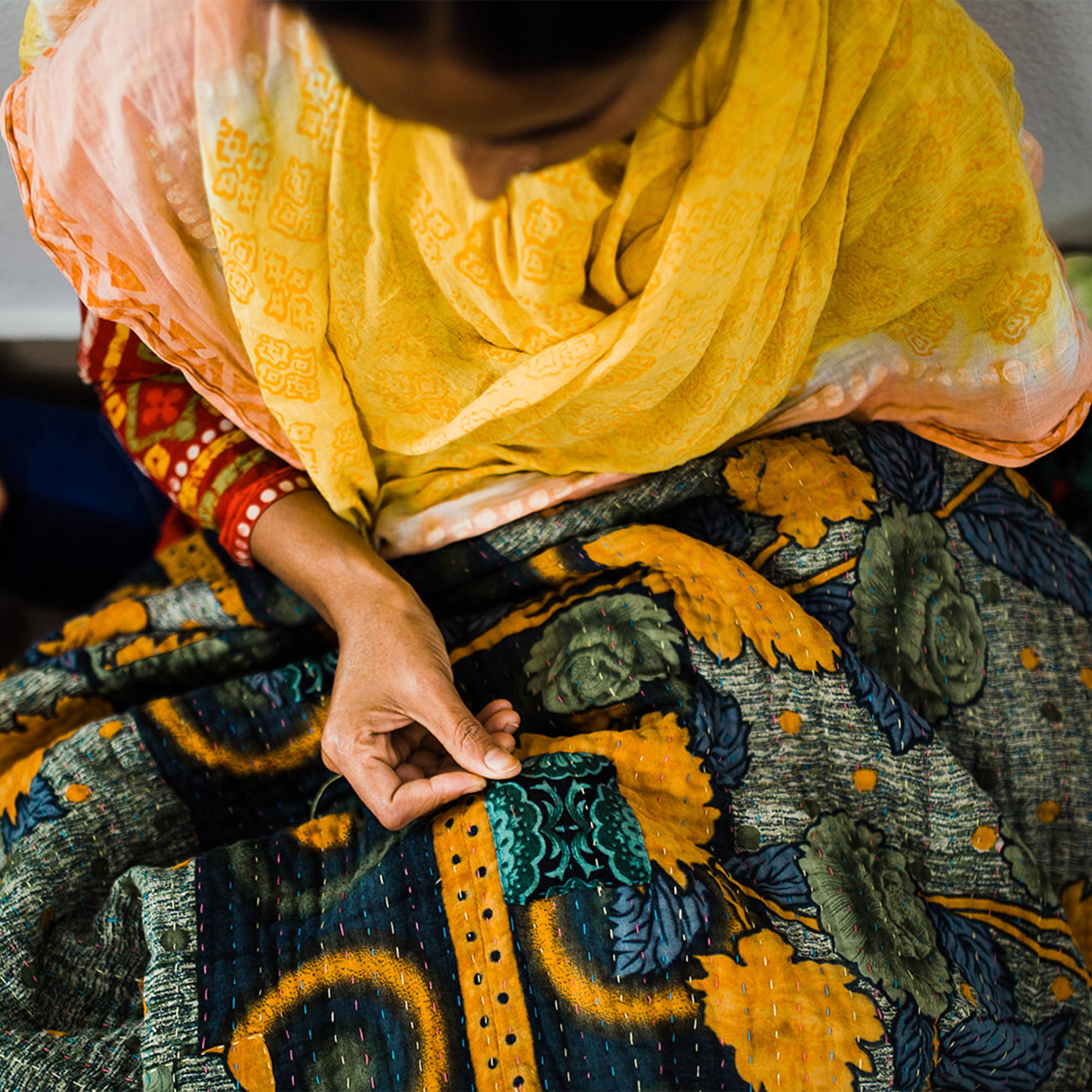 Artisan hand-stitches a Kantha Quilt | The Little Market